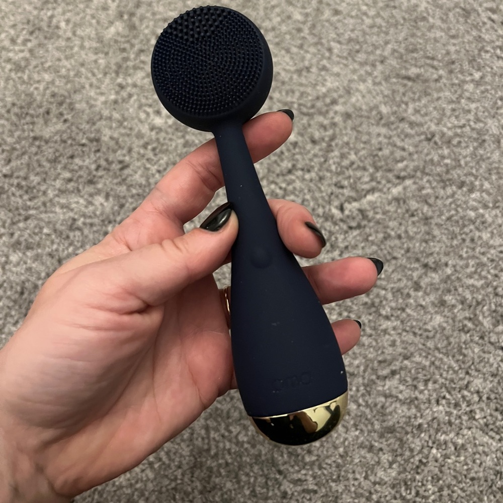 Navy blue PMD Facial Cleaner tool